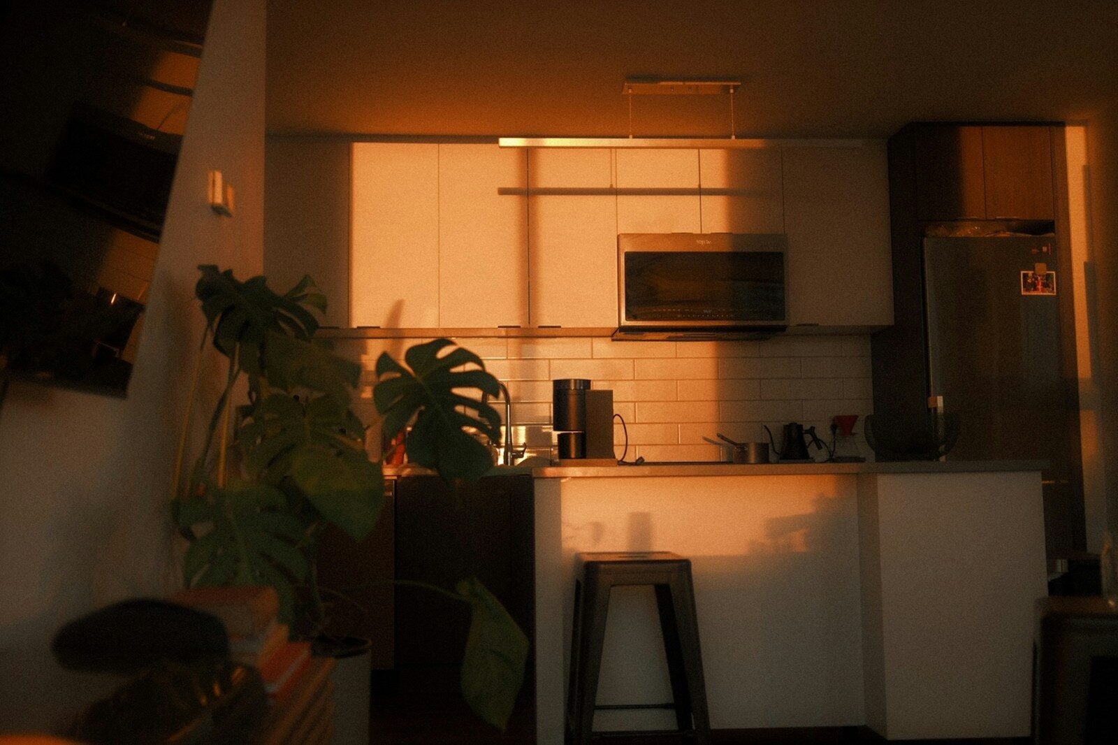 Kitchen illuminated by warm sunset light