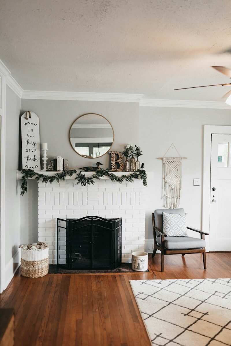 white fireplace mantel with decors