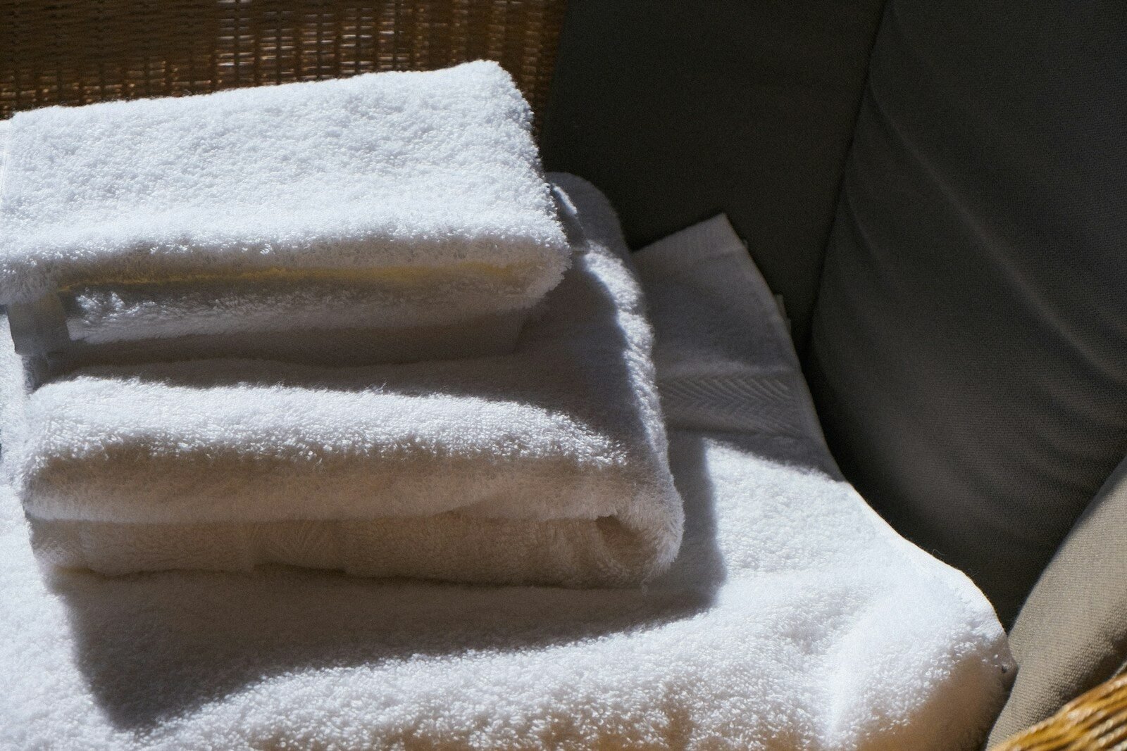 Stack of clean white towels on a surface