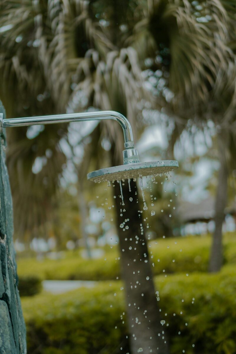 Outdoor shower with water droplets falling